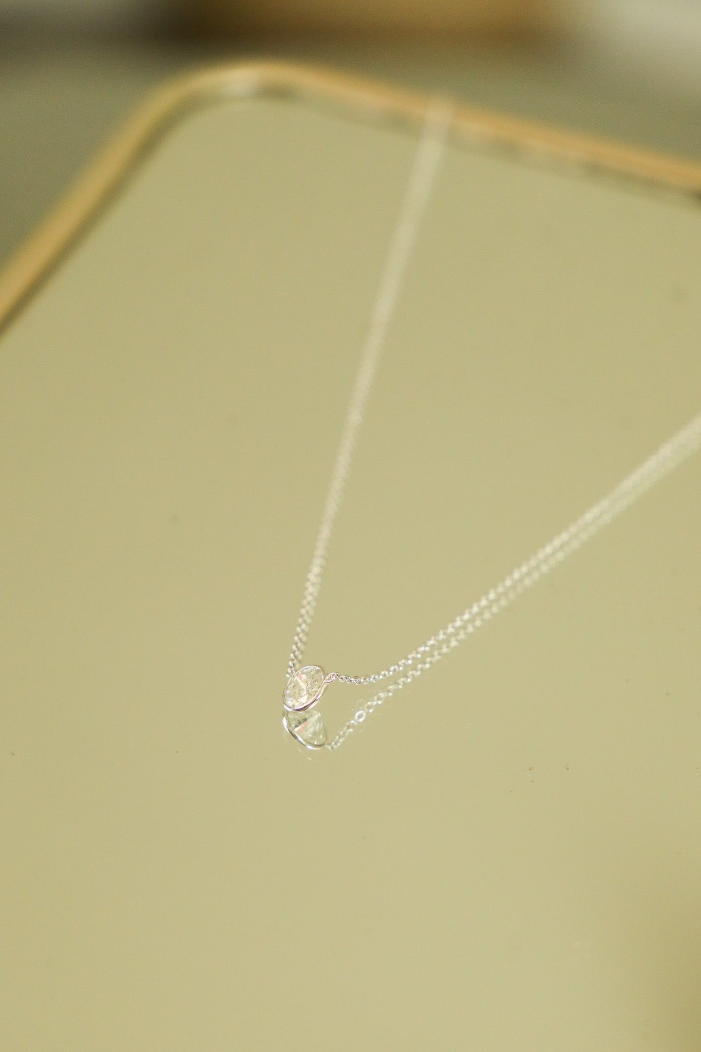 N046 - 14k WG Necklace w/1 Bezel Set Round Diamond 0.875cts