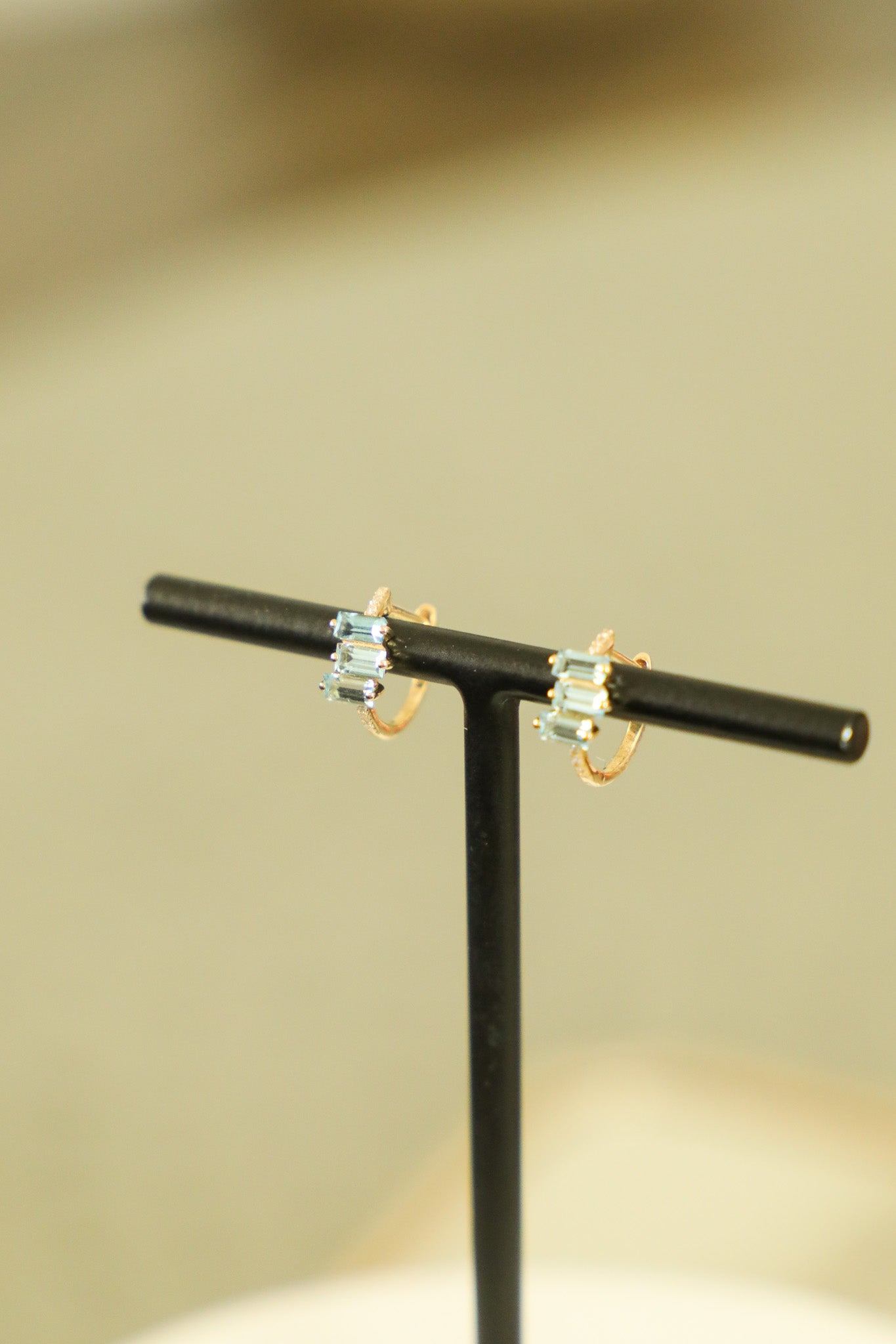 E179 - 14k YG 11mm Hoops w/12 Round Diamonds (0.03cts) & 6 Baguette Blue Topaz (0.80cts)